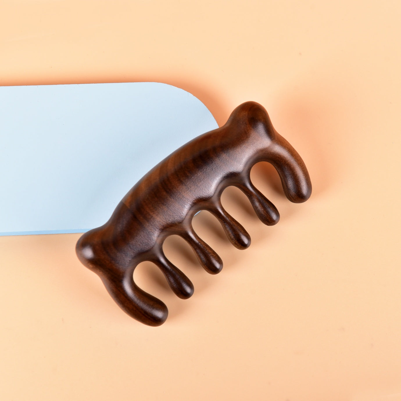 Massageur à racloir en forme d'ours